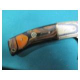 Hand crafted knife with a leather s...