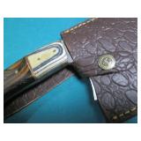 Hand crafted knife with a leather s...