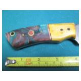 Hand crafted knife with a leather s...