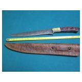 Hand crafted knife with a leather s...