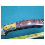 Hand crafted knife with a leather s...