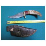 Hand crafted knife with a leather s...