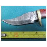 Hand crafted knife with a leather s...