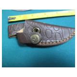 Hand crafted knife with a leather s...