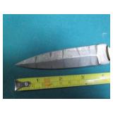 Hand crafted knife with a leather s...