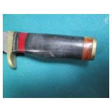 Hand crafted knife with a leather s...