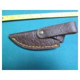 Hand crafted knife with a leather s...