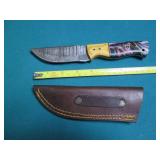 Hand crafted knife with a leather s...