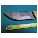 Hand crafted knife with a leather s...