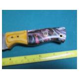 Hand crafted knife with a leather s...