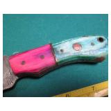 Hand crafted knife with a leather s...