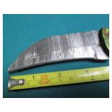 Hand crafted knife with a leather s...