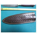 Hand crafted knife with a leather s...