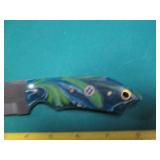 Hand crafted knife with a leather s...