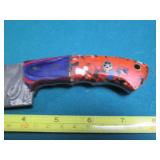 Hand crafted knife with a leather s...