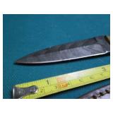 Hand crafted knife with a leather s...