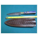 Hand crafted knife with a leather s...