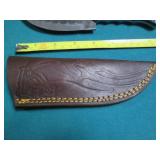 Hand crafted knife with a leather s...