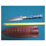 Hand crafted knife with a leather s...