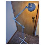 Adjustable White Floor Lamp with Articulating Arm and Weighted Base