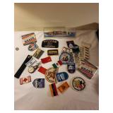 Collection of Vintage Travel Patches, Keychains, Vietnam Memorabilia, and Souvenir Ship Model