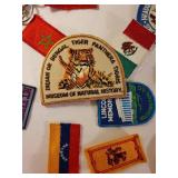 Collection of Vintage Travel Patches, Keychains, Vietnam Memorabilia, and Souvenir Ship Model