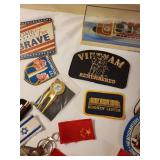 Collection of Vintage Travel Patches, Keychains, Vietnam Memorabilia, and Souvenir Ship Model