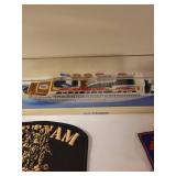 Collection of Vintage Travel Patches, Keychains, Vietnam Memorabilia, and Souvenir Ship Model