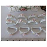 Porcelain Rose Table Decor Collection with Basket, Napkin Rings, and Wooden Stand