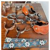 Collection of Western Spurs with Tooled Leather and Beaded Strap