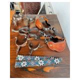 Collection of Western Spurs with Tooled Leather and Beaded Strap