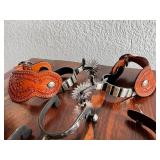 Collection of Western Spurs with Tooled Leather and Beaded Strap
