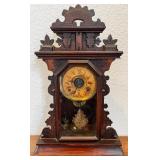 Antique Wooden Mantel Clock with Ornate Carving and Glass Door