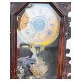 Antique Wooden Mantel Clock with Ornate Carving and Glass Door