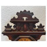 Antique Wooden Mantel Clock with Ornate Carving and Glass Door