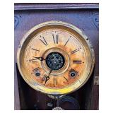 Antique Wooden Mantel Clock with Ornate Carving and Glass Door