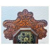 Antique Wooden Case Mantel Clock with Ornate Carving and Glass Panel