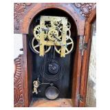 Antique Wooden Case Mantel Clock with Ornate Carving and Glass Panel