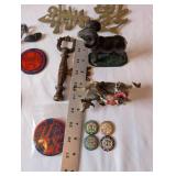 Eclectic Vintage Collectibles Lot with Figurines, Brass Signs, and Tokens