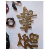 Eclectic Vintage Collectibles Lot with Figurines, Brass Signs, and Tokens