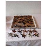 Collection of Vintage Plastic Cowboy and Native American Toy Figures on Horses