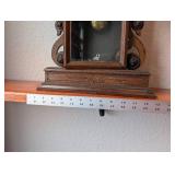 Antique Wooden Mantel Clock with Ornate Carvings and Key