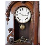 Antique Wooden Mantel Clock with Ornate Carvings and Key