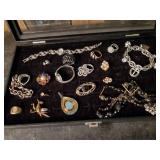 Nice collection of costume jewelry and watches in display case
