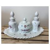 This is a vintage Westmoreland milk glass dresser set in the "Paneled Grape" pattern, hand-painted with a "Roses & Bows" design. The set includes two perfume bottles with stoppers, a covered powder bo