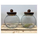 Vintage general store style canister set, The item is a set of four clear glass jars with solid wooden lids and a matching wooden storage rack