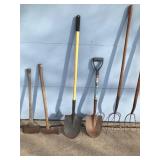 2 Spade Shovels - 2 - Pitch Forks - 2 - Axes and one has a mall on one side