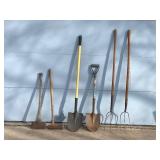 2 Spade Shovels - 2 - Pitch Forks - 2 - Axes and one has a mall on one side