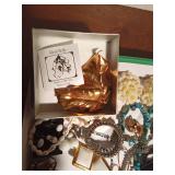 Flat of jewelry including 24K dipped holly ornament, Sarah Coventry, Western Germany, Celebrity, Trifari and more