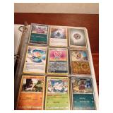 Binder of 9+0 Pokemon trading cards